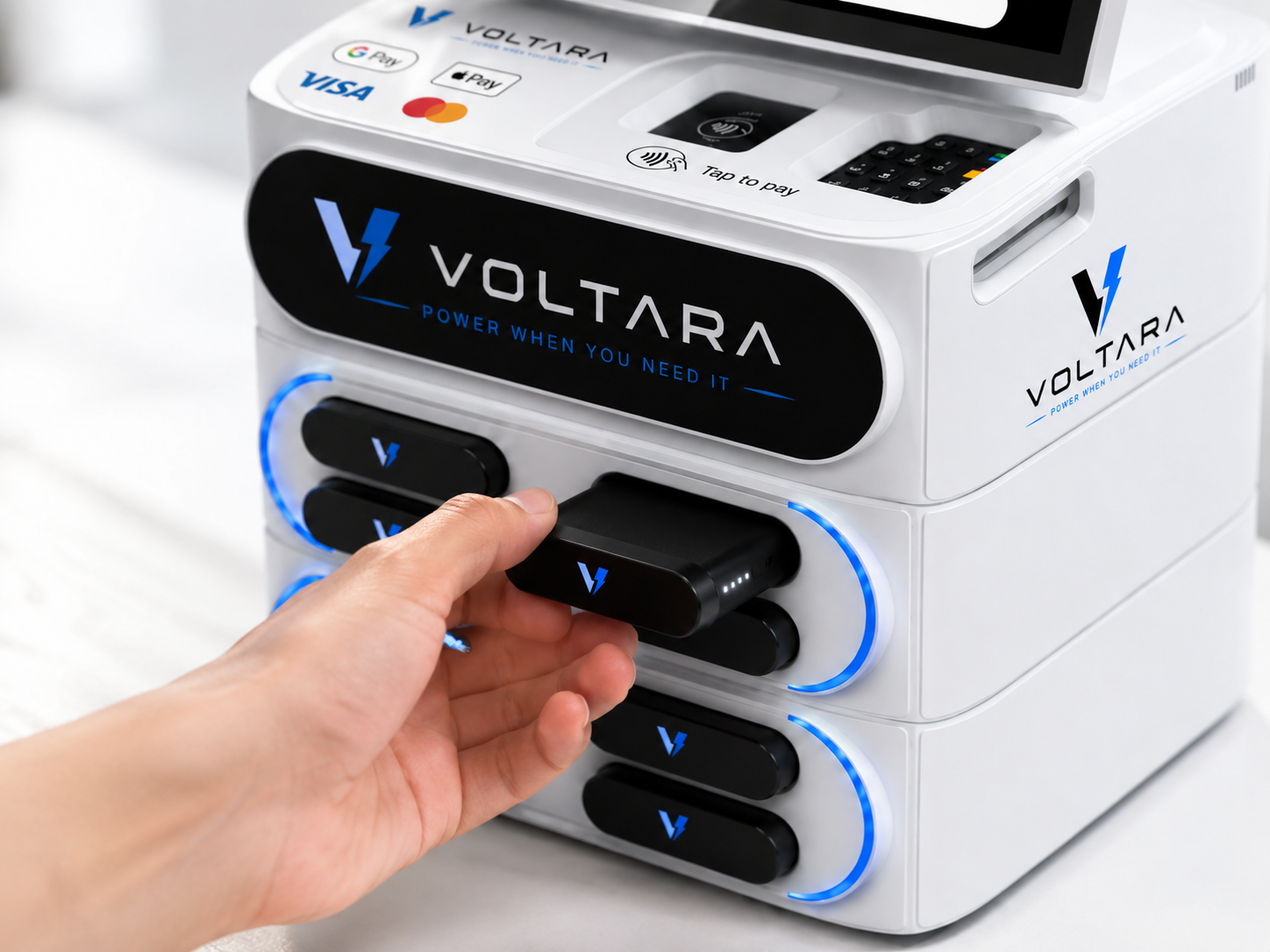 Customer taking a portable charger from a Voltara rental station